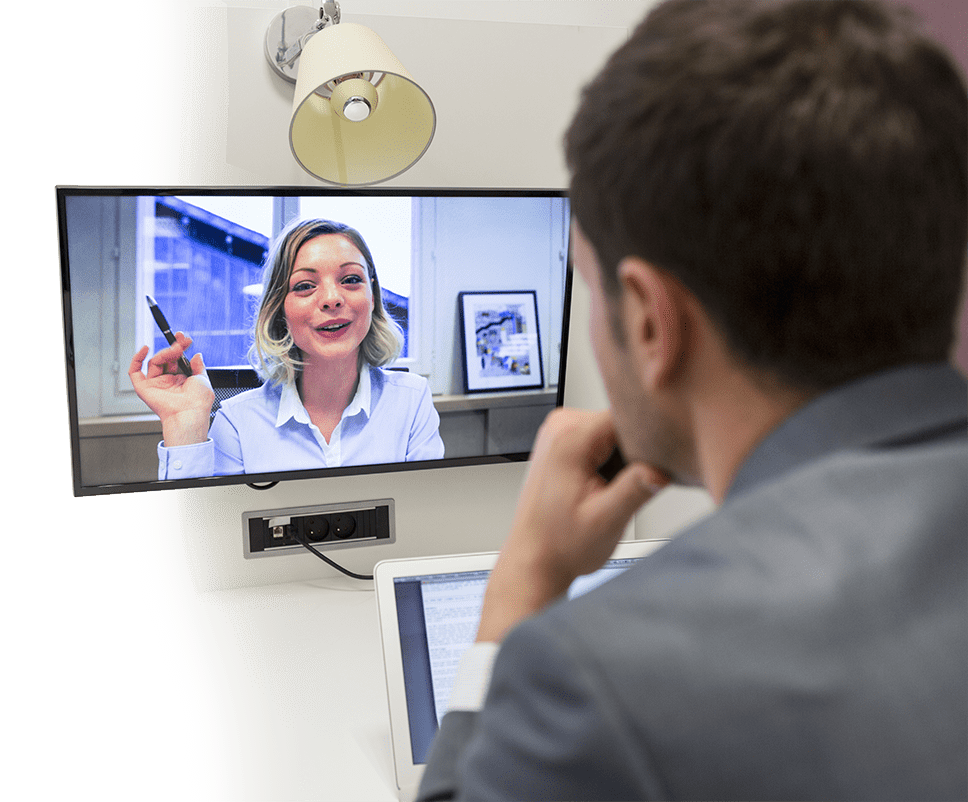 Client on a video call with an accountant on a wall monitor