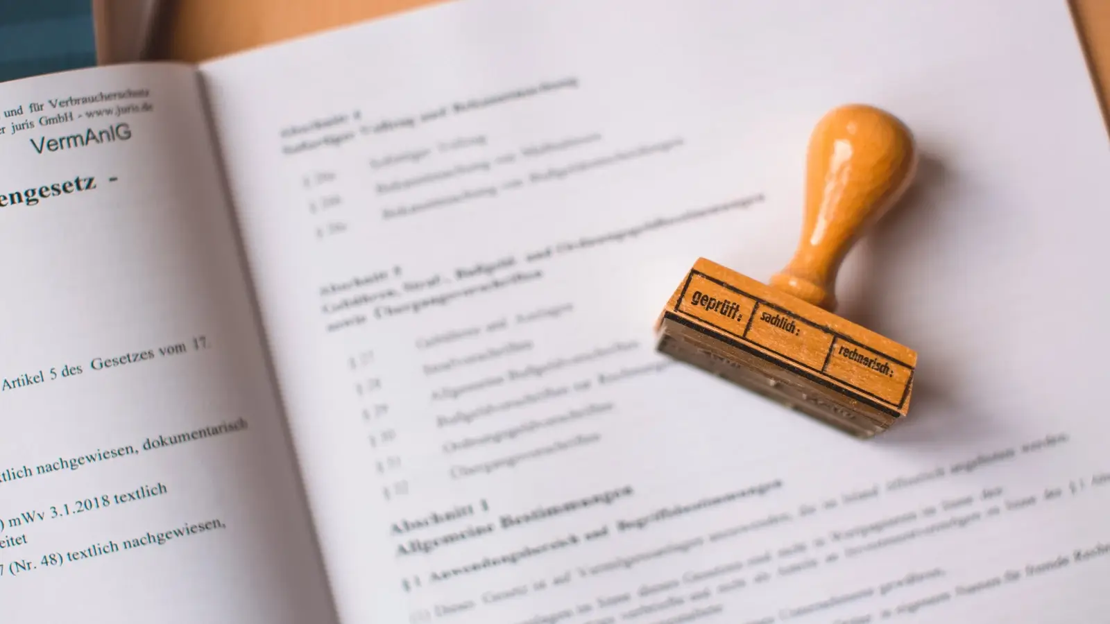 Stack of paperwork with a rubber stamp resting on top